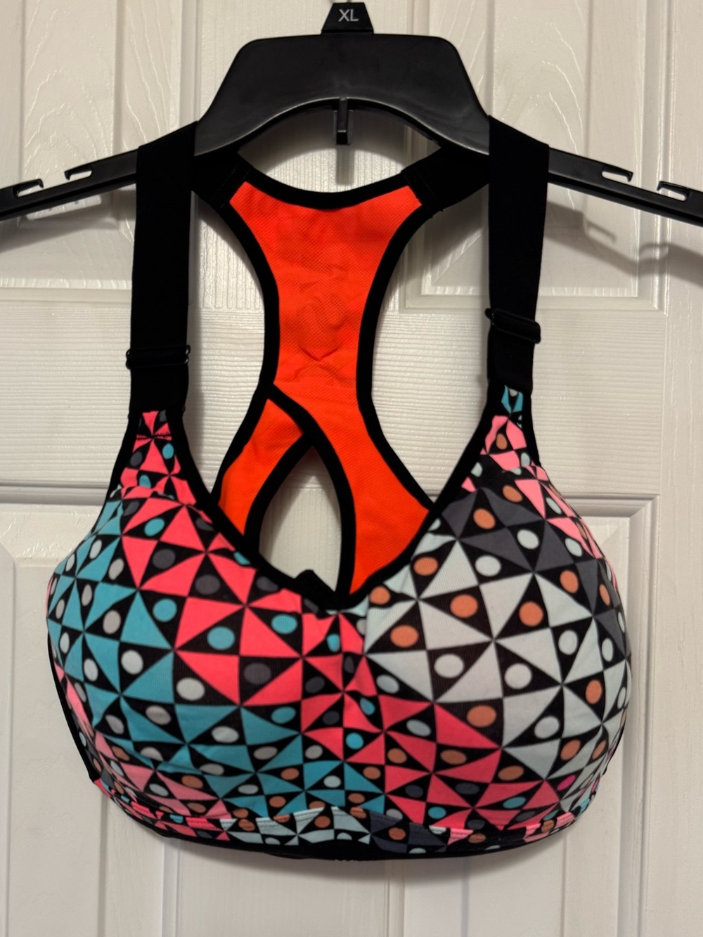 VSX Geometric Print High-Impact Sports Bra in Orange and Multicolor
